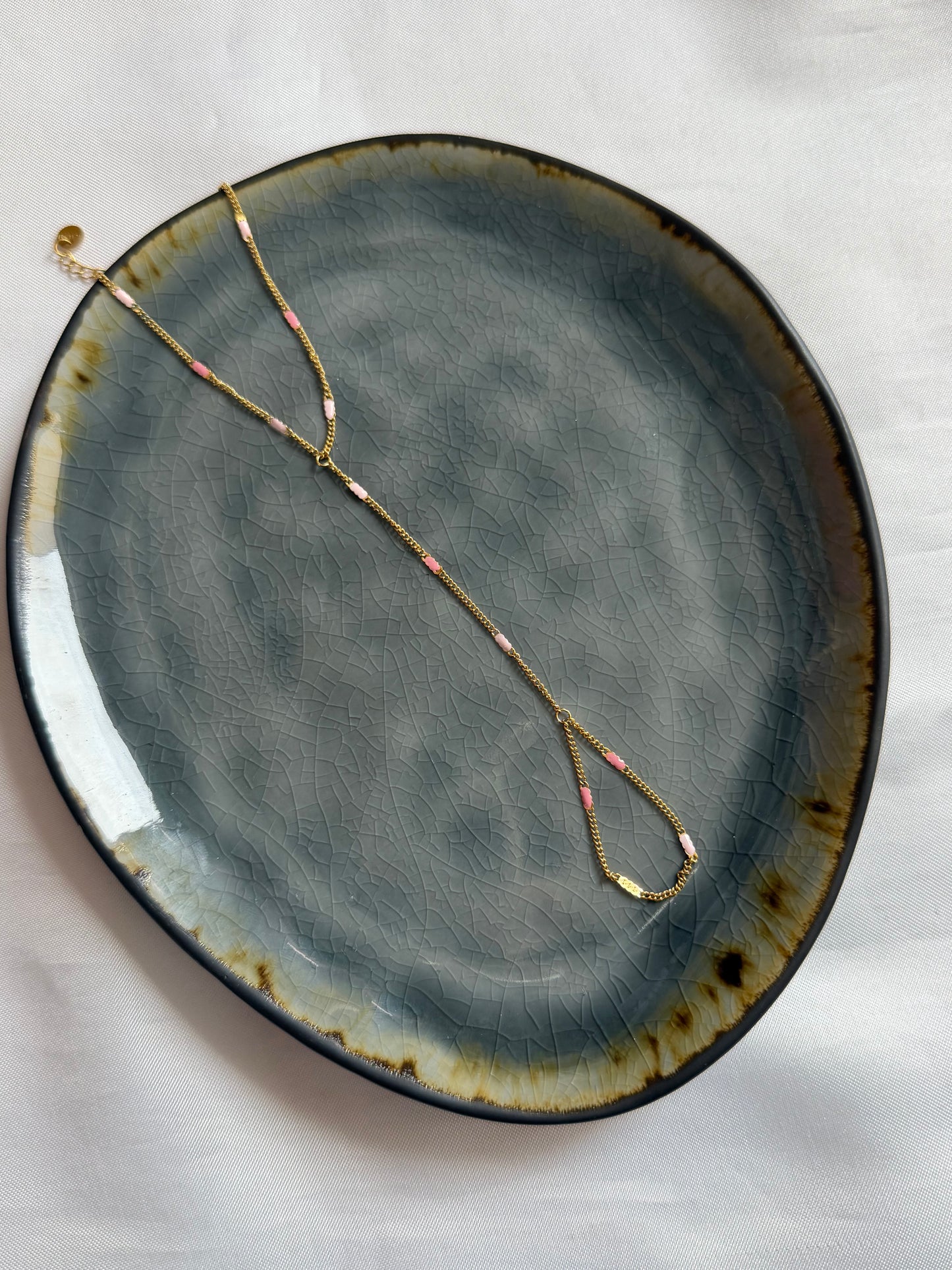 ‘PINK’ hand chain - goud