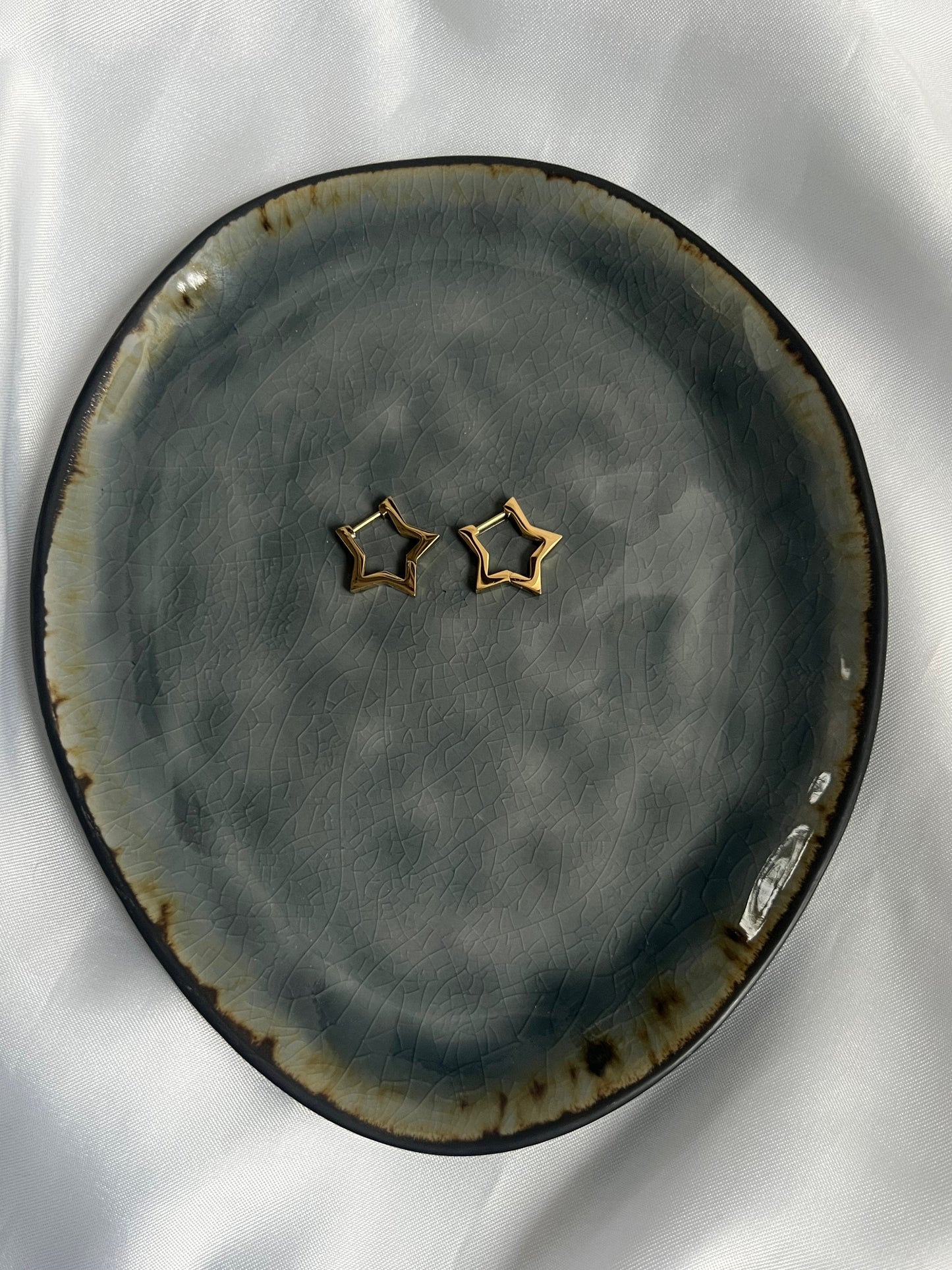 Statement star oorbellen - goud/zilver