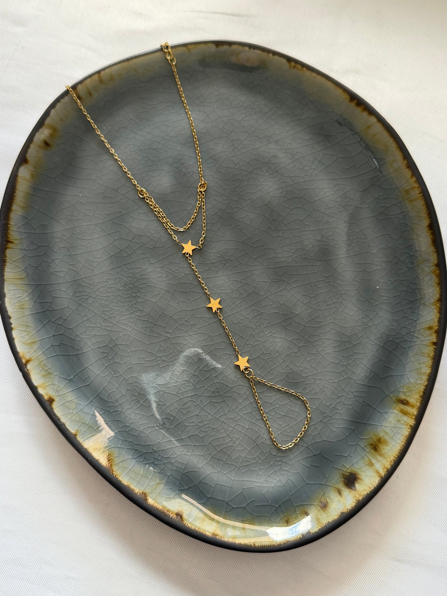 ‘STARS’ hand chain - goud