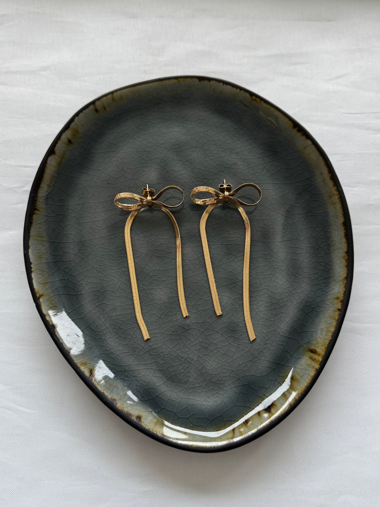 ‘PARTY BOW’ oorbellen - goud/zilver