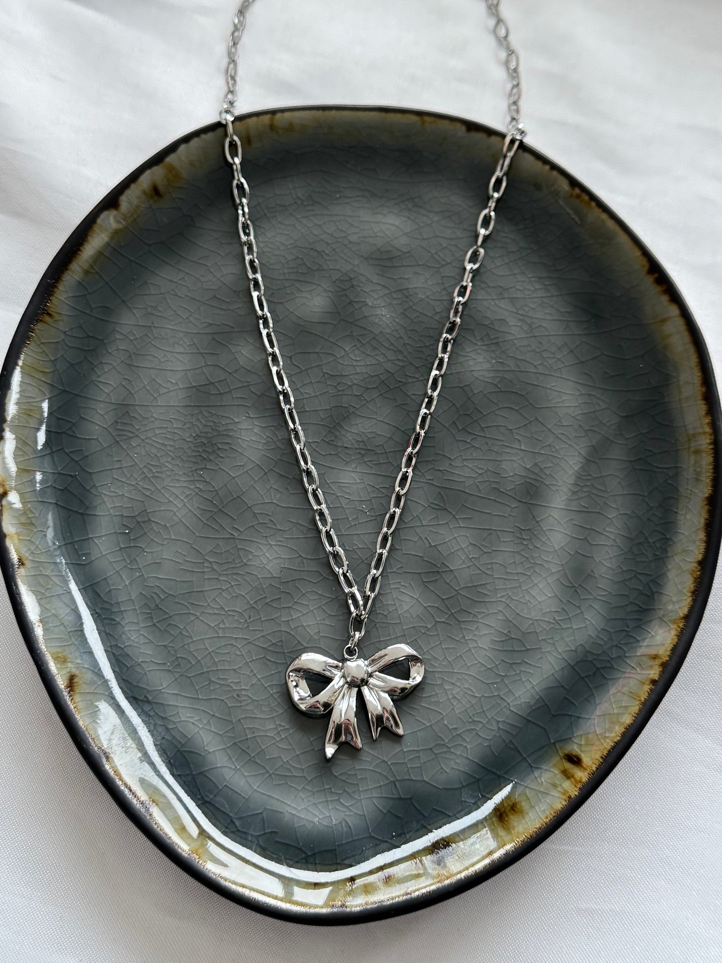 ‘BOW’ ketting - goud/zilver