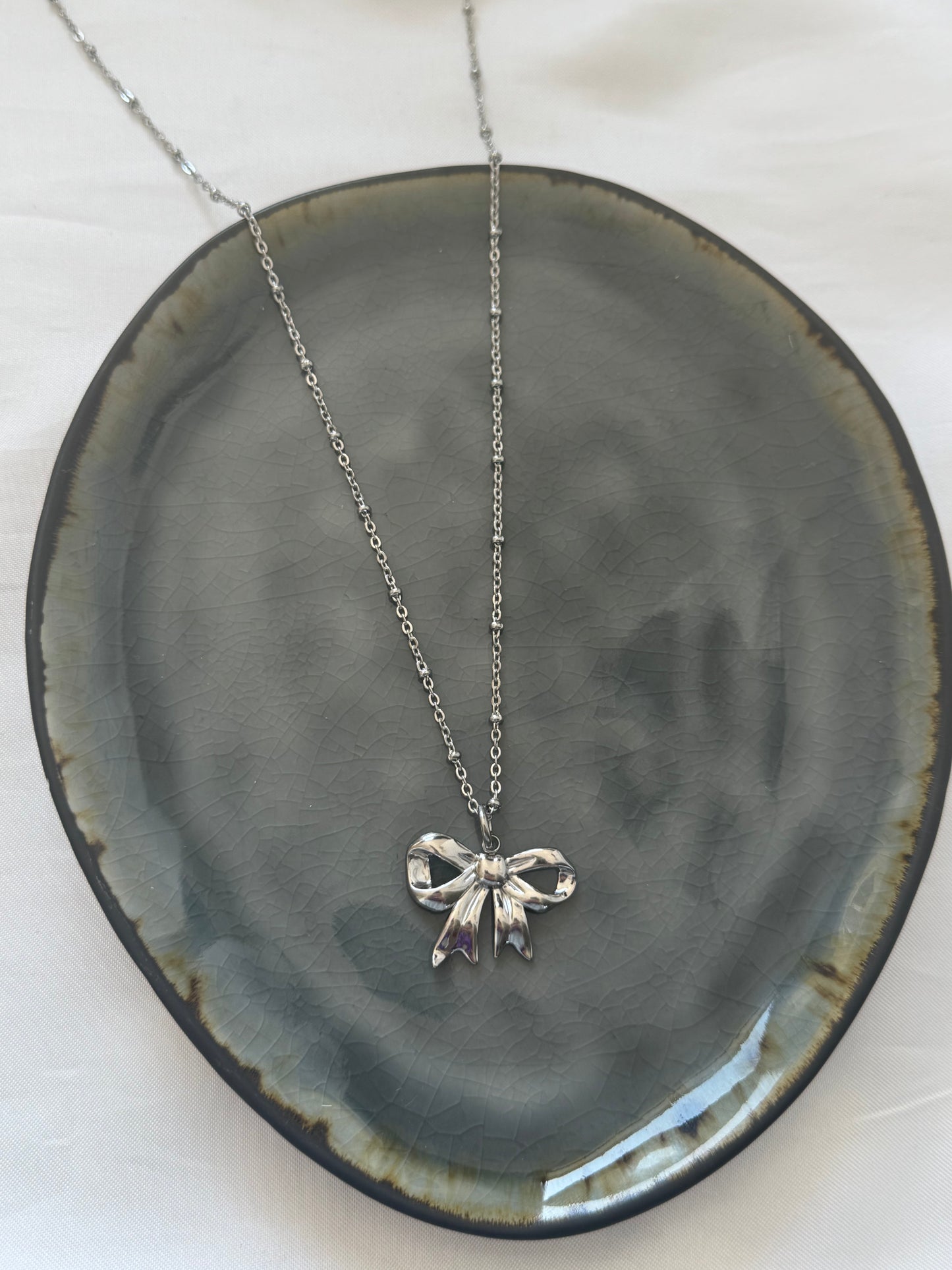 ‘CLASSIC BOW’ ketting - goud/zilver