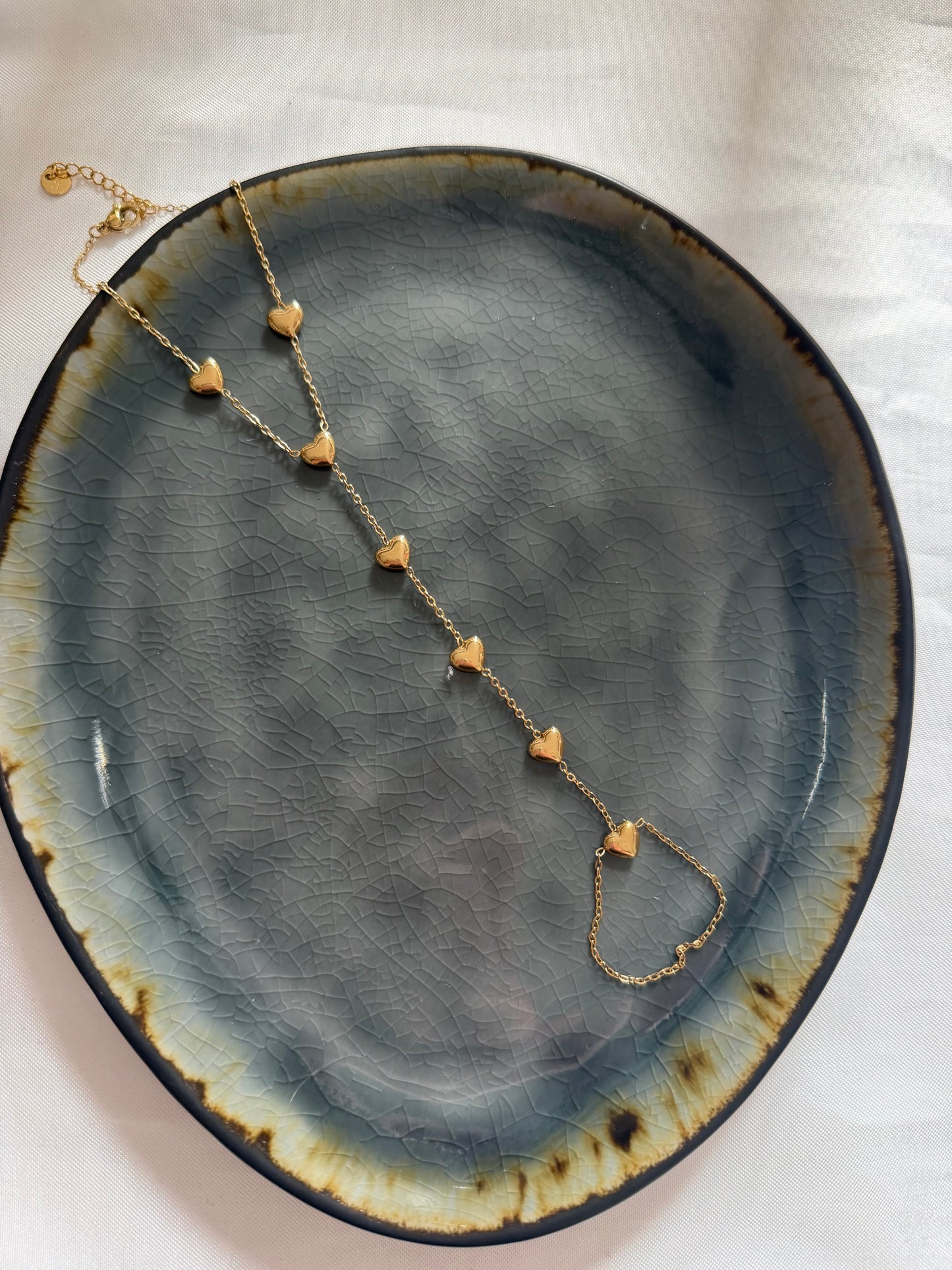 ‘HEARTS’ hand chain - goud/zilver