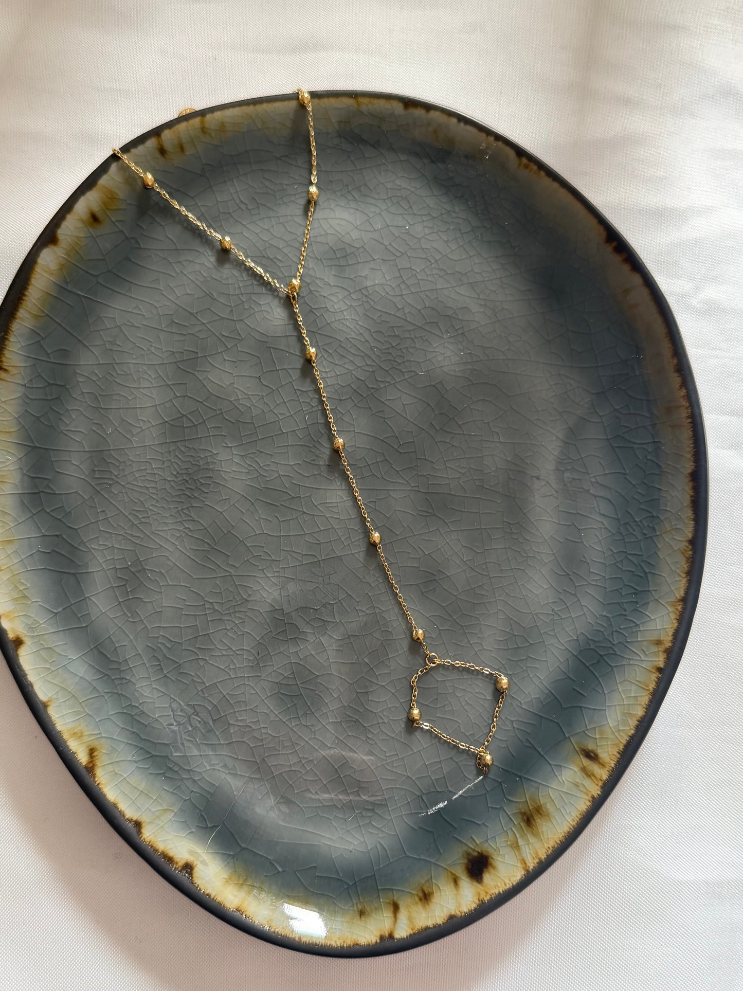 ‘DOTS’ hand chain - goud/zilver