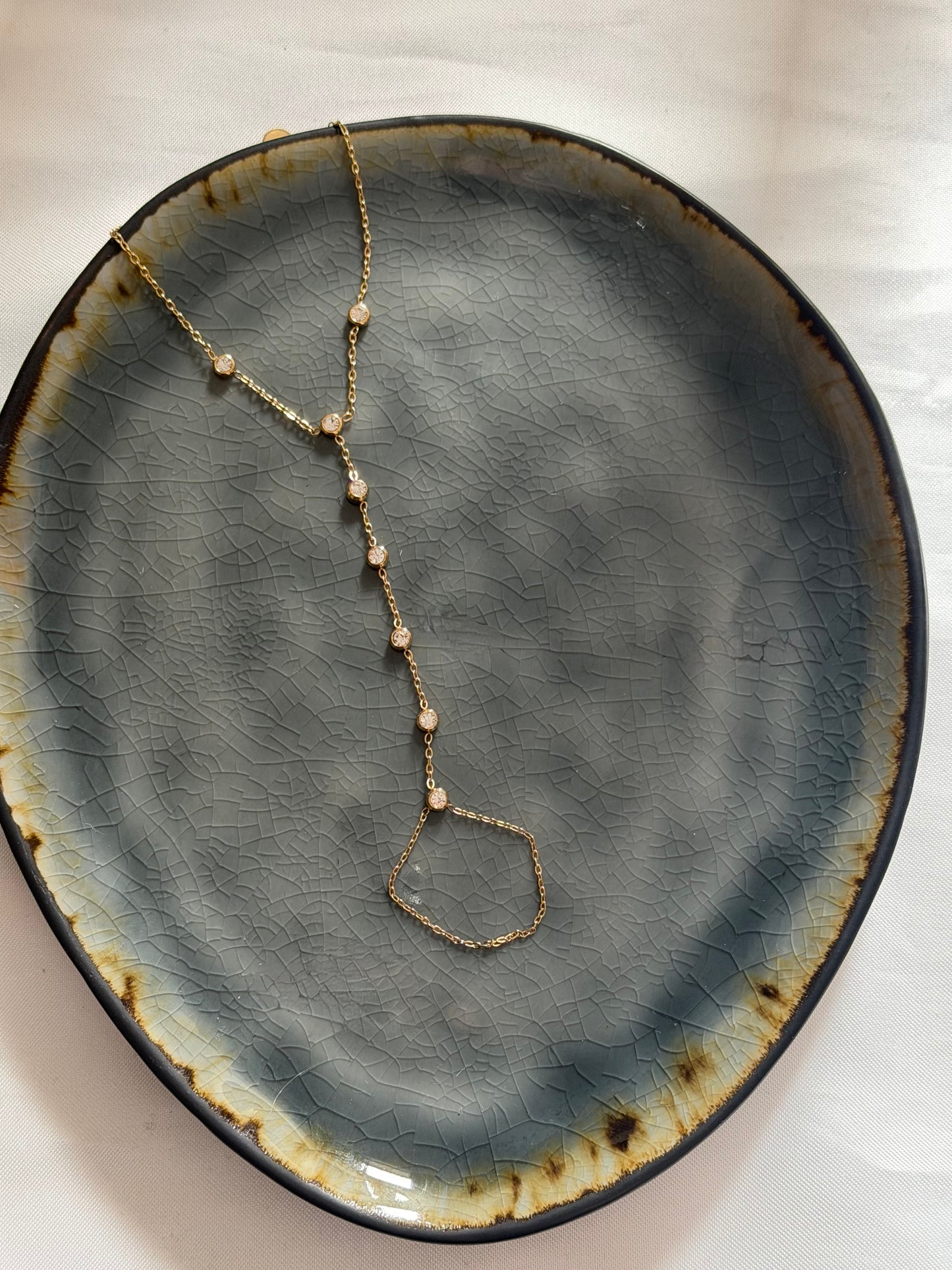 ‘SPARKLES’ hand chain - goud/zilver