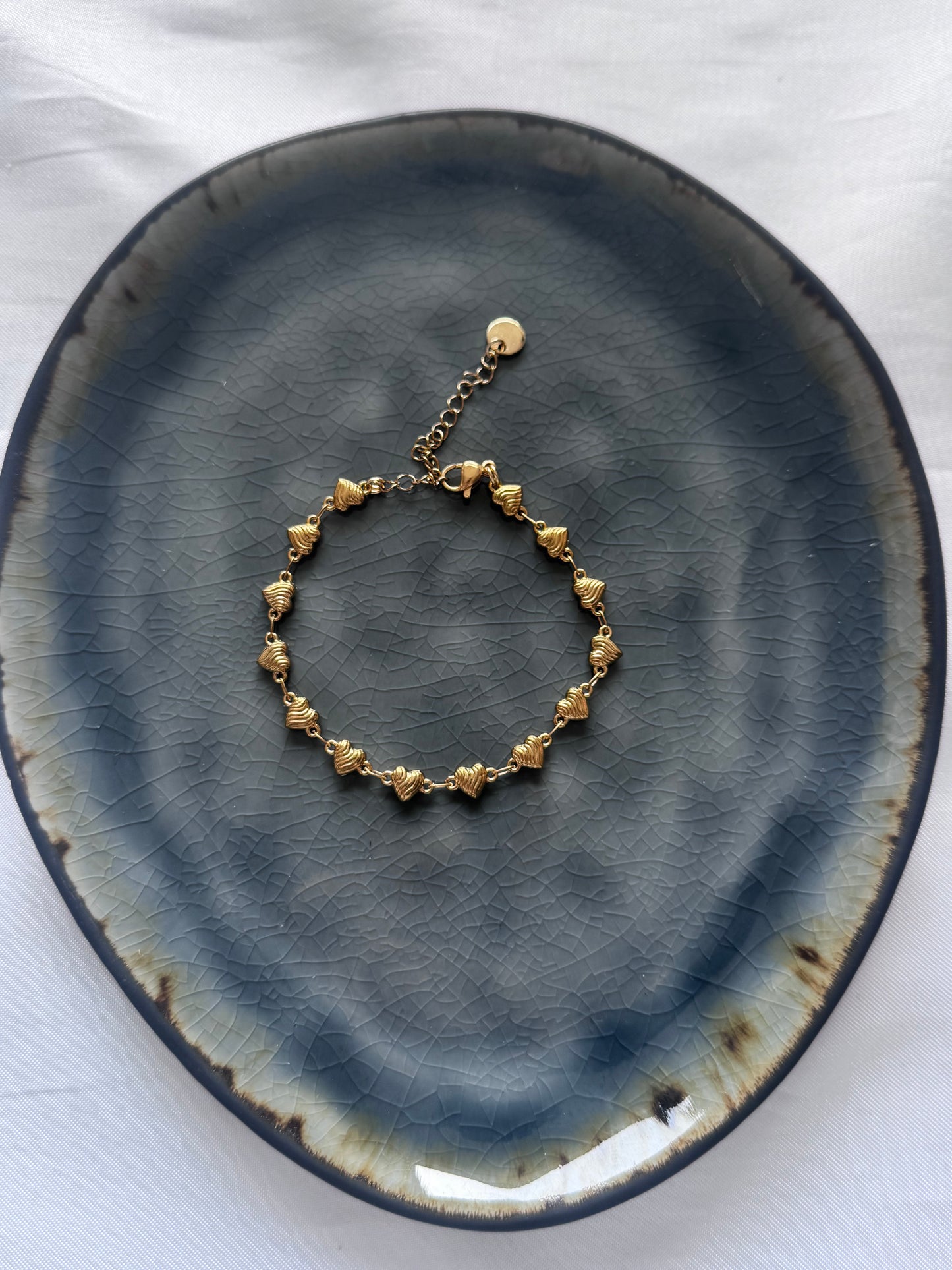 ‘TWISTED LOVE’ armband - goud