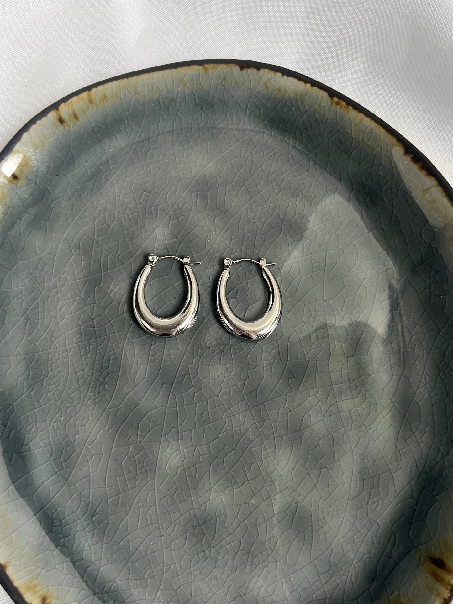 Twinkle hoops oorbellen - goud / zilver