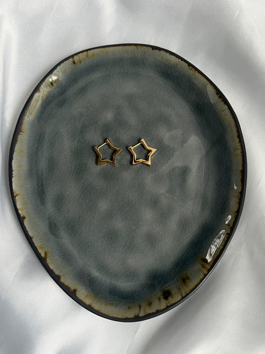 Statement star oorbellen - goud/zilver