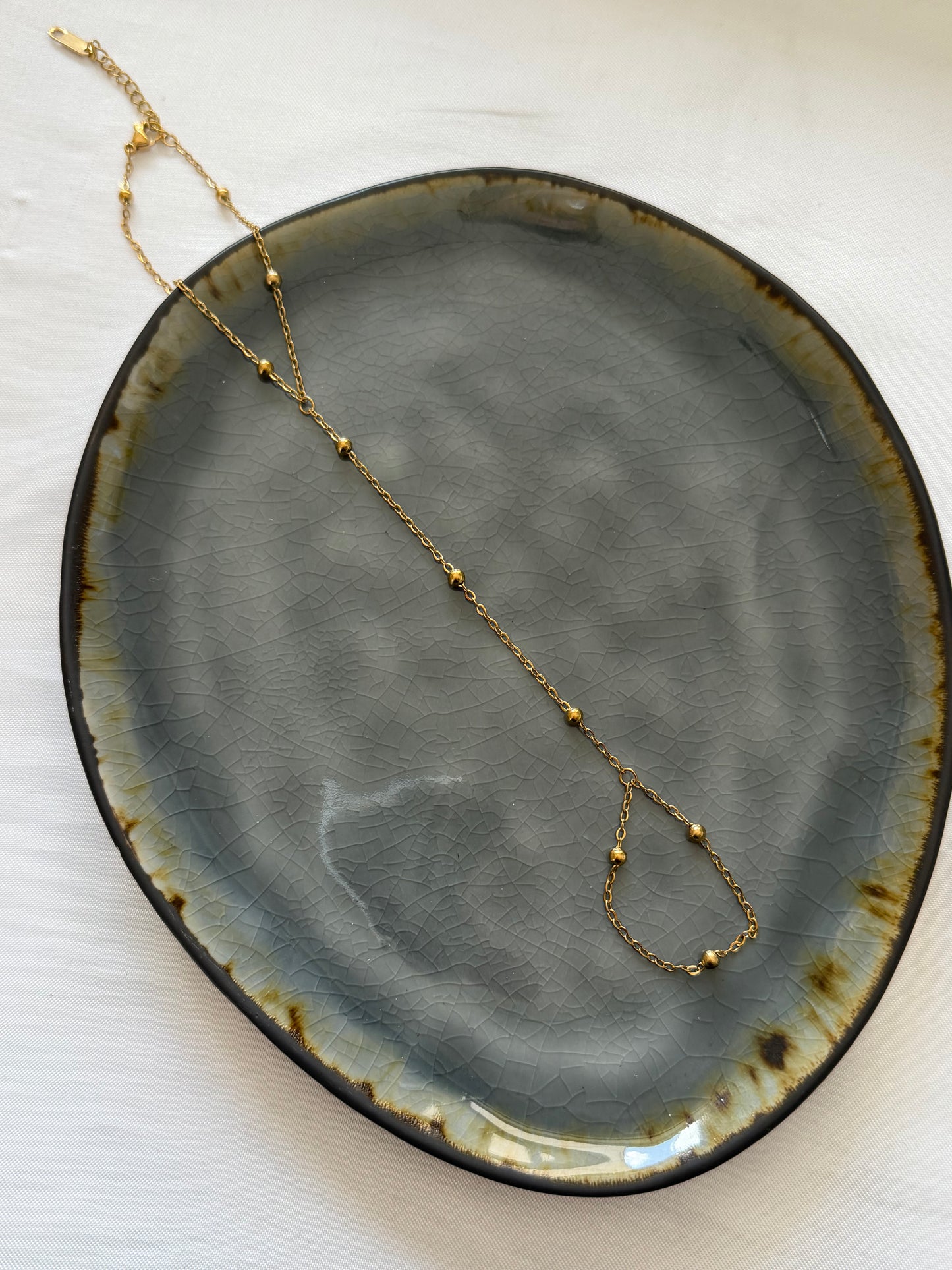 ‘LITTLE DOTS’ hand chain - goud