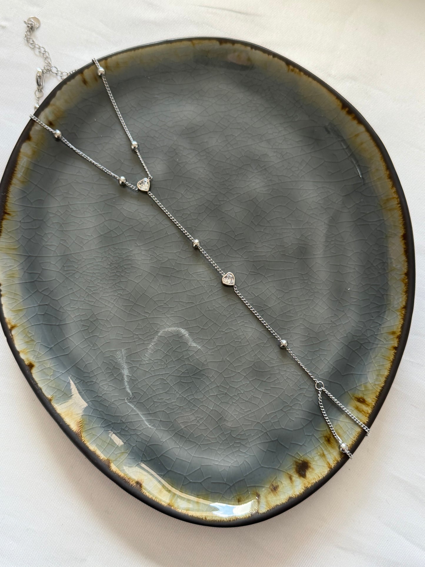‘LOVELY’ hand chain - goud/zilver