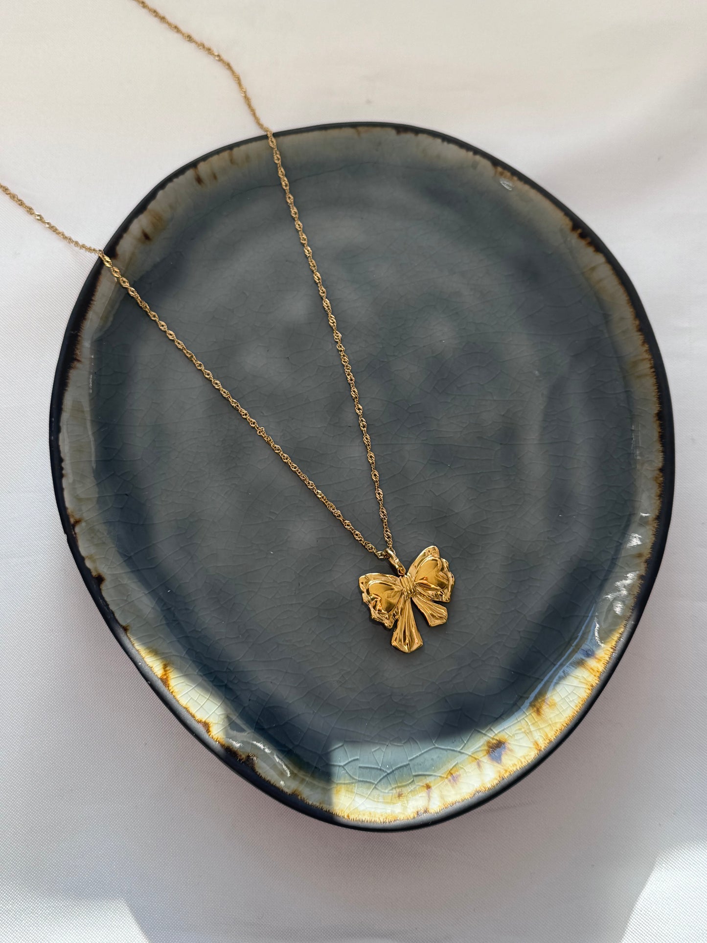 ‘BOW’ lange ketting - goud