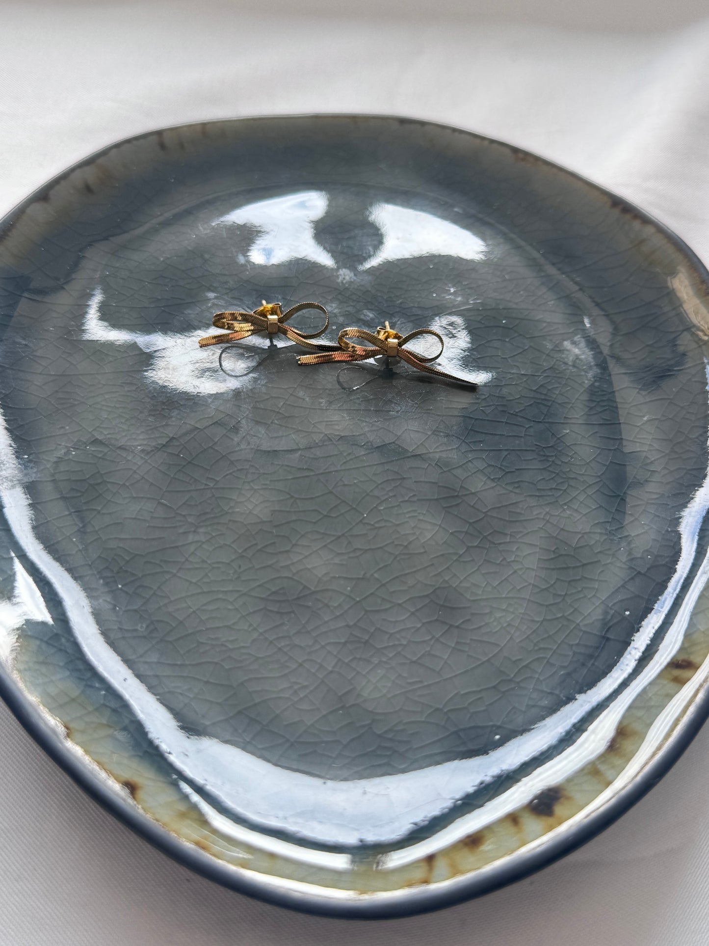 ‘STRIKJES’ oorbellen - goud/zilver