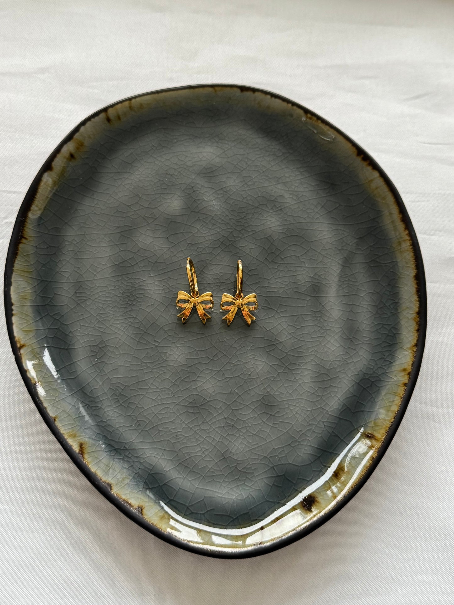 ‘LITTLE BOW’ oorbellen - goud/zilver