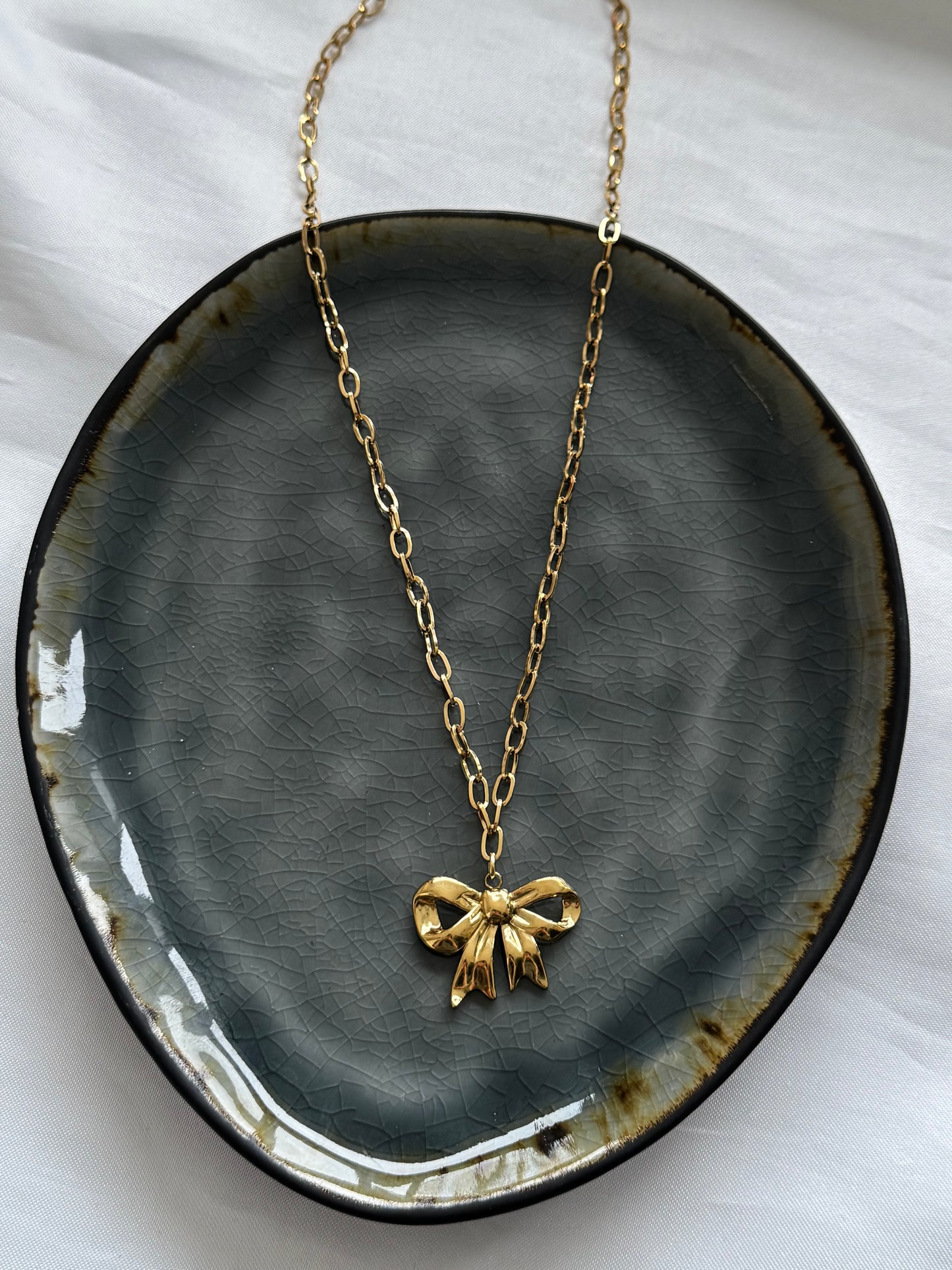 ‘BOW’ ketting - goud/zilver
